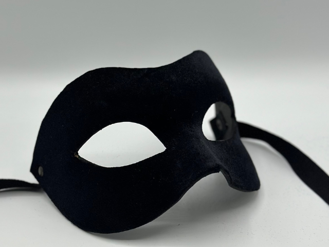 Black mask covered with black velvet. Black masquerade mask for man.