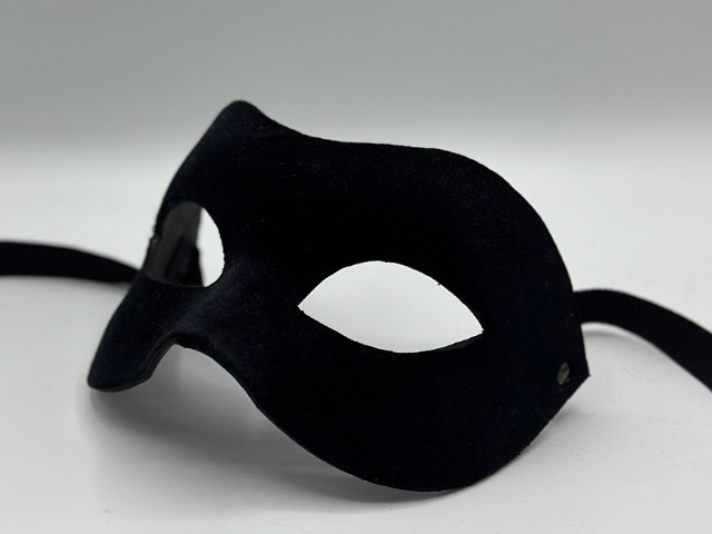 Black mask covered with black velvet. Black masquerade mask for man.