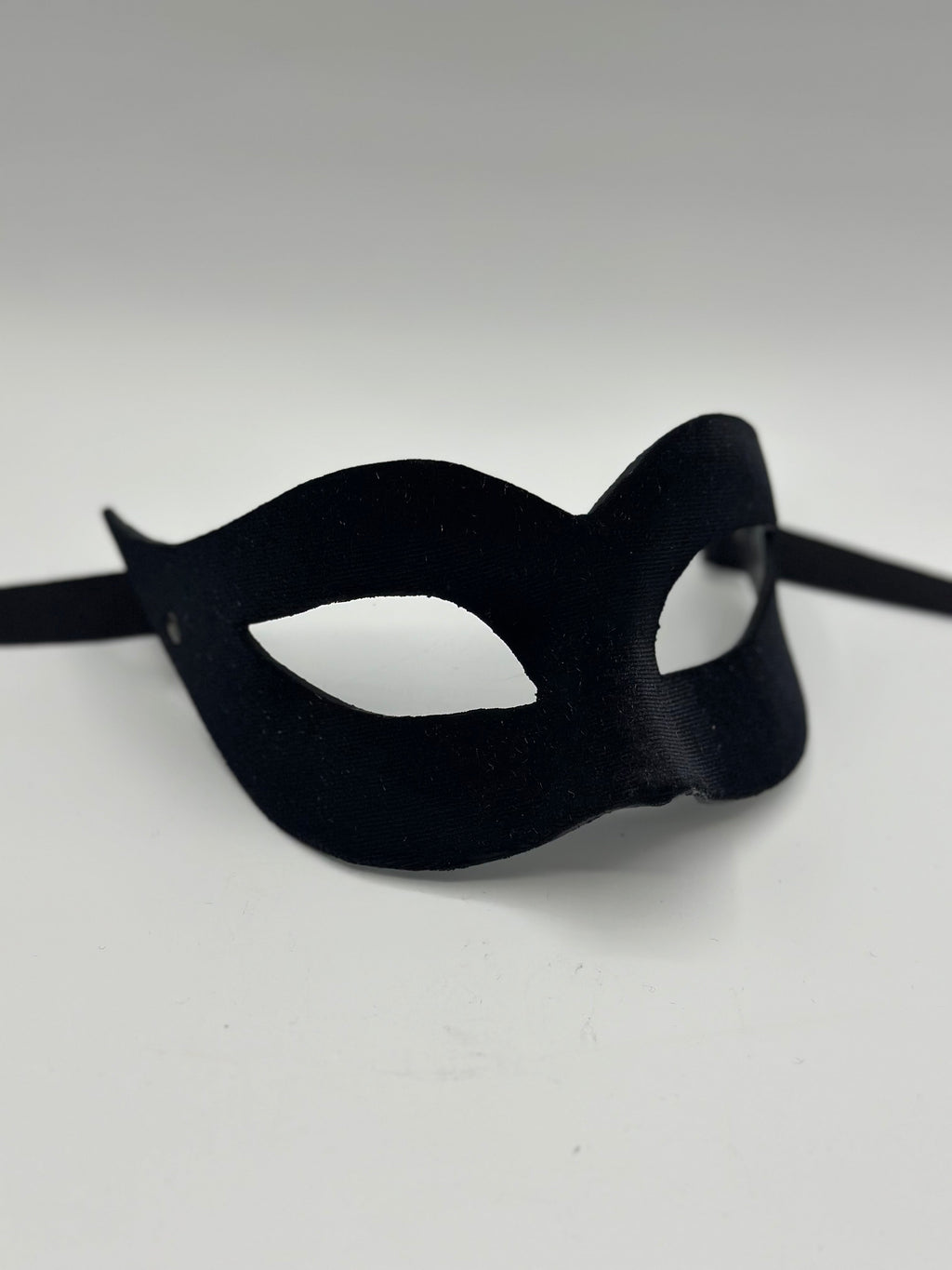 Mask covered with black velvet. Black masquerade mask for woman.