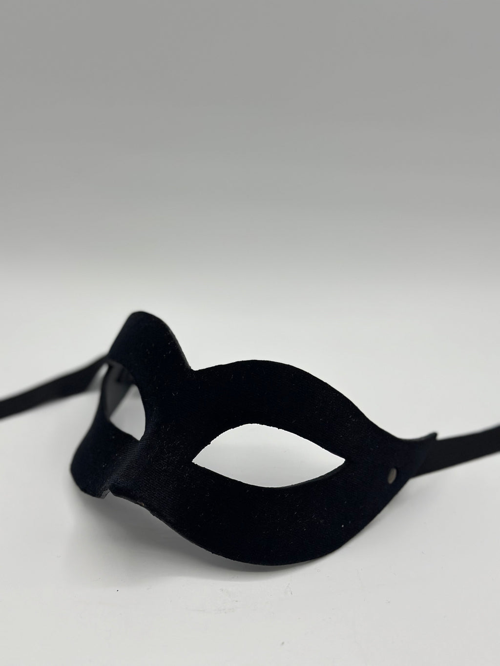 Mask covered with black velvet. Black masquerade mask for woman.